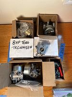 Overview of carburetors in boxes with label 8HP Toro Tecumseh