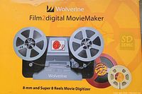 Front of box showing the Wolverine Film2Digital MovieMaker device image and product name, highlighting 8mm and Super 8 reels digitization capability.