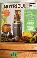 Front view of Nutribullet box showing blender and accessories with fruits around