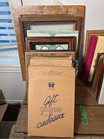 Overview of stacked photo frames including Avon boxed collection