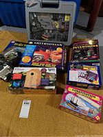 Overview photo showing all boxed kits and the microscope case arranged on the floor, illustrating the full lot contents.