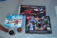 Overview of all lot contents including three boxed sets, two Bionicle canisters