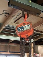 Close-up of the upper body of the chain hoist showing the Nitchi brand label and 1 tonne capacity.