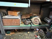 Full shelf view showing Pioneer receiver, turntable, circular saw and assorted wooden pieces