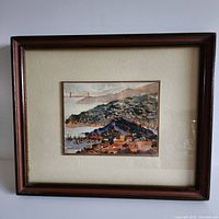 Framed watercolour print showing San Francisco cityscape with Golden Gate Bridge in the background.