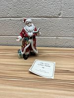 2002 Lenox Santa Claus figurine shown with gift box and certificate.