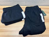 Two folded black Wild Fable sweat shorts with elastic waistbands and visible size tags.