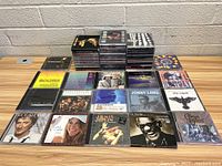 Front view of the entire collection showing multiple stacks and laid out CDs with cover art