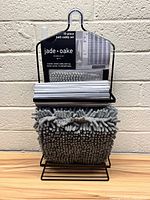 Front view of the 15-piece bath caddy set packaging including caddy, rug, curtain and hooks
