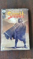 Front cover view of The Legend of Mother Sarah comic book showing title, illustration of cloaked figure, and indication of issue number and publisher.
