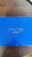 Top view of original blue Sony PlayStation 2 box with PS2 logo