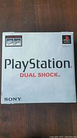 Top view of original PlayStation 1 Dual Shock box showing Sony and PlayStation logos prominently