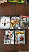 Front cover view of the 5 PlayStation 2 video game cases showing titles and cover art.