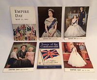 Top view of six booklets showing their front covers, including five Empire Day booklets from 1951-1956 and one Songs of the Commonwealth book