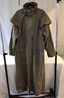 Full front view of long coat showing overall design, color, and length.