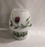 Full side view of the Murano style mushroom lamp showing the floral painted motifs and the shape resembling a mushroom with a rounded top and cylindrical base.