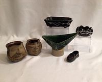 Photo of all six pottery items together on white background showing overall lot.