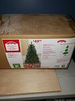 Box showing image and details of the artificial 3 ft Christmas tree with 600 branch tips.