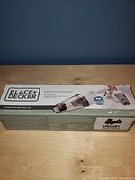 Box front showing brand, product image, and basic features. Highlights lithium-ion battery and cordless design.