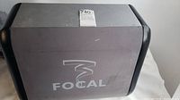 Front view of Focal speaker with logo and wear marks.