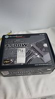 Closed product box showing brand SilverStone Strider Series 1500W low noise power supply with modular cables and VGA3 certification.