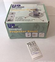 Box front and top of Upright UP210 universal projector mount showing product image and key features.