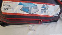 Storage bag of Outbound 14-person Grand Tent showing brand and capacity.