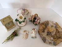 Full lot contents including clock, music box, flower basket, angel magnets, and more arranged on white background