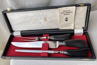 Complete Birks carving set in original presentation box with satin lining and red felt base.