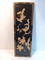 Full view of the rectangular black lacquer plaque displaying birds and flowers with mother of pearl inlays and decorative border
