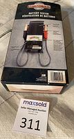 Photo of original Motomaster battery tester box showing product image and barcode.
