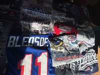 Top-view of folded jersey, packaged T-shirts and loose shirts