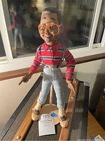 Full view of the Steve Urkel doll standing upright showing outfit and shoes