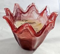Close-up of Jammaro Home Murano glass candle holder with wavy ruffled edges and visible chip on rim