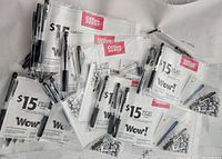 Photo shows multiple packaged Pentel Wow! Gel pens each with an Office Depot $15 gift card promotion visible.