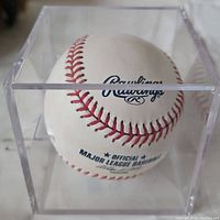 Official Rawlings Major League Baseball in acrylic display case showing branding and condition.