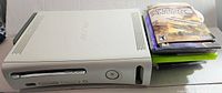White Xbox 360 console with power and disc tray view