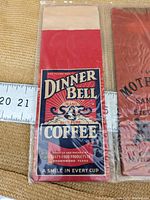 Dinner Bell Brand Salt Coffee one-pound paper packaging with colorful vintage design and text from Brownwood, Texas.