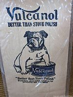Close-up of one Vulcanol advertisement paper featuring the bulldog and stove polish can illustration.