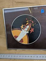 Full view of the framed artwork showing female figure with flowing hair and colorful abstract background.