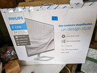 Front view of the Philips E Line 24-inch monitor box showing brand and product line, size, screen technology details.
