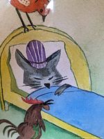 Close-up of cat in purple hat sleeping in a yellow bed with two birds, one red perched above and one brown in front.