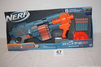 Nerf Elite 2.0 Shockwave RD-15 dart blaster in box, showing the full product including blaster, drum, and darts.