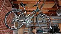 Full side view of bike hung in garage