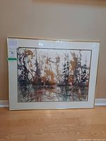 Front view of the framed abstract watercolour painting depicting a forest scene with various brown and tan tones. The painting is signed by the artist and has a gold-tone frame.