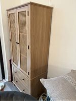 Angled full view of the cabinet showing front and side elevation