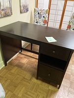 Full front-side view of the brown office desk showcasing the flat top and the side storage with drawer and cabinet beneath.