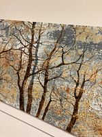 Detailed side view of the canvas artwork showing multiple intertwining tree branches against a textured background with rust, gray, and green tones.