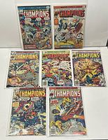 Seven bagged and boarded Marvel Comics The Champions issues laid out on a surface.