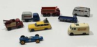 Full collection of 8 Matchbox vehicles alongside each other on a white surface, showing variety of colors and styles.